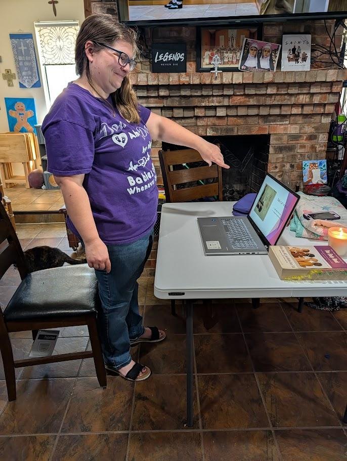 Melanie teaching a class from a laptop
