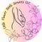 Pregnant silhouette with a rose on her belly surrounded by flowers 